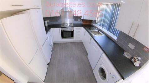 Bright and modern kitchen featuring a full set ...