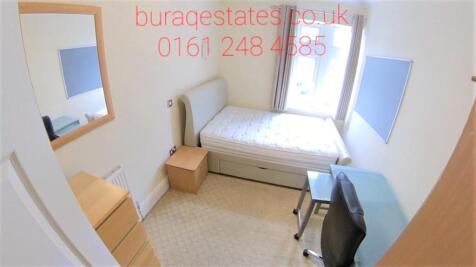 A bright and tidy single bedroom featuring a be...