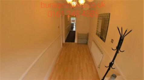 A clean and well-maintained hallway featuring w...