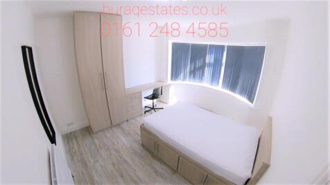 Bright and clean single bedroom featuring a lar...