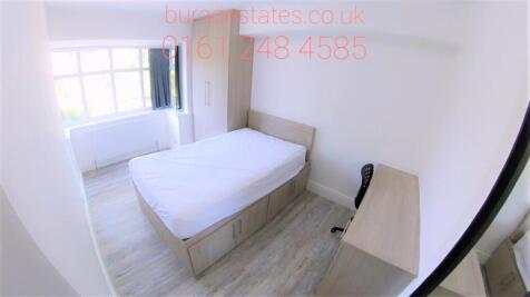 Bright and tidy single bedroom featuring a larg...