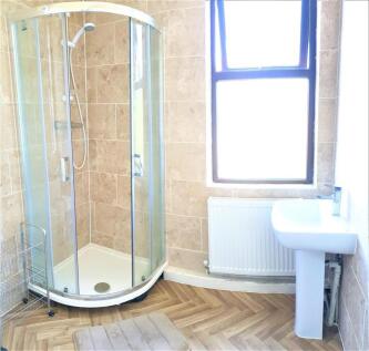 Bright and modern bathroom suite featuring a sp...