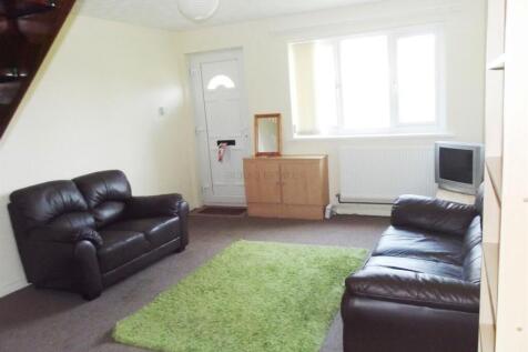 Cozy living room featuring two comfortable leat...