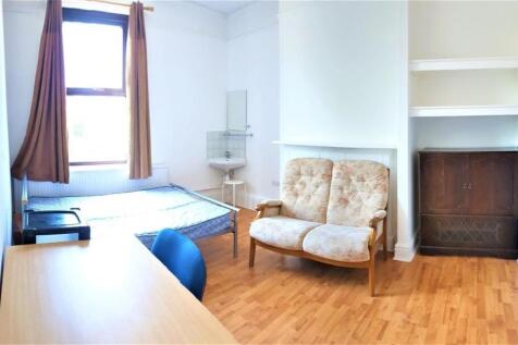 Bright single bedroom featuring a comfy bed pos...
