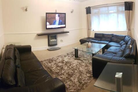 A contemporary living room featuring two black ...