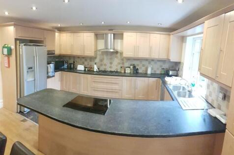 Bright and spacious kitchen featuring modern ca...