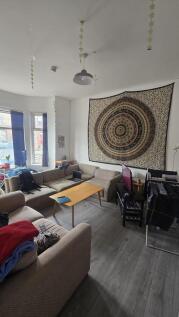 A cozy living room featuring a spacious L-shape...