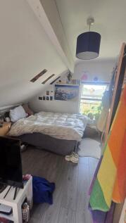 A cozy double bedroom with a large comfortable ...