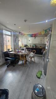 A bright and welcoming kitchen space featuring ...