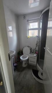 A compact and functional bathroom featuring a c...
