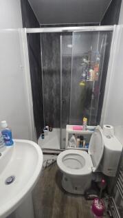 A compact and functional bathroom featuring a m...