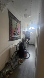 A bright hallway featuring decorative hanging s...