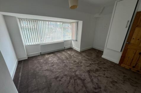 Bright and spacious master bedroom featuring a ...