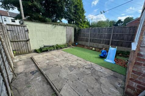 A charming and private garden space featuring a...