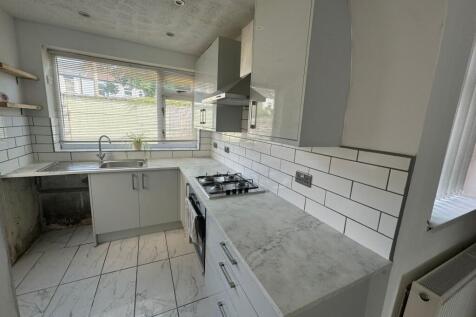 Bright and modern kitchen featuring a gas hob, ...