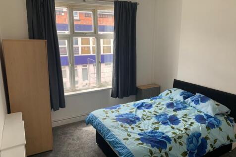 Bright and cozy double bedroom featuring a comf...