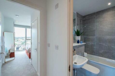 A bright and modern bathroom featuring a stylis...