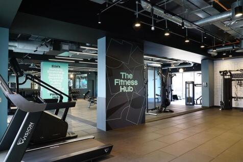 A modern fitness hub featuring an array of gym ...