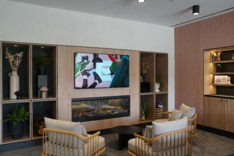 A stylish and spacious living room featuring mo...