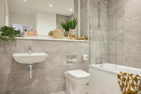 A modern and clean bathroom featuring a bath an...