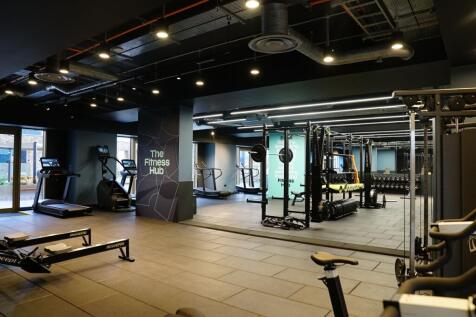 Modern fitness hub featuring a variety of cardi...
