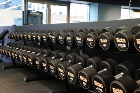 Well-maintained gym space featuring a wide rang...