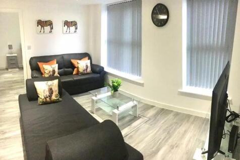 A modern and inviting living room featuring two...