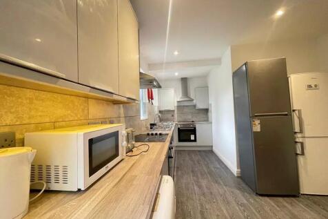 Modern kitchen with ample cabinetry, integrated...