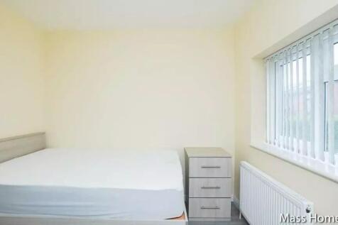 Bright and tidy double bedroom featuring a comf...