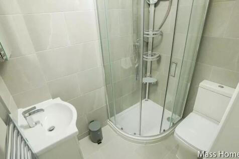 A modern, well-maintained bathroom featuring a ...
