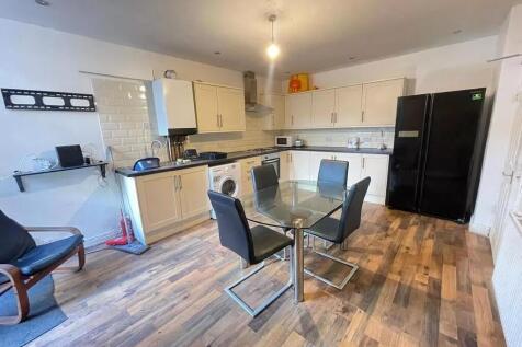 Bright and modern kitchen featuring a spacious ...