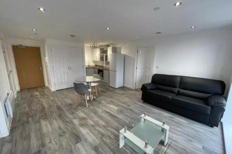 A modern, open-plan living area featuring sleek...
