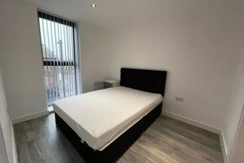 A modern double bedroom featuring a comfortable...