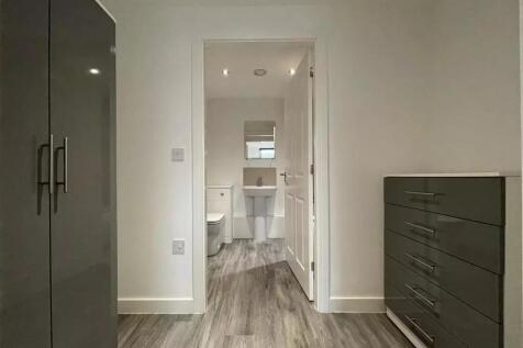 A modern ensuite bathroom with clean lines and ...