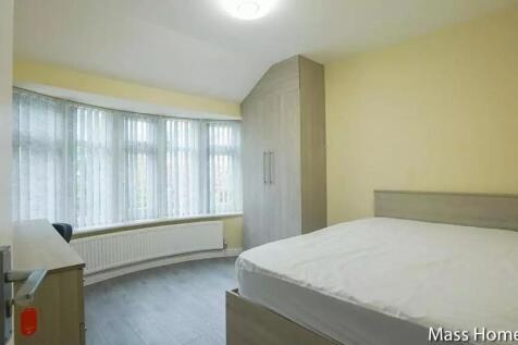Bright and tidy double bedroom featuring a larg...
