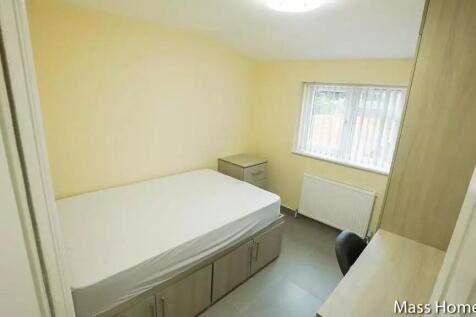 A bright and tidy single bedroom featuring a co...