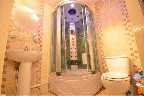 Bright and modern bathroom featuring a spacious...