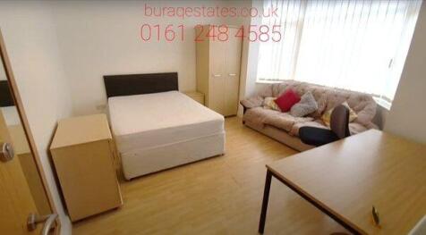 Bright and spacious master bedroom featuring a ...