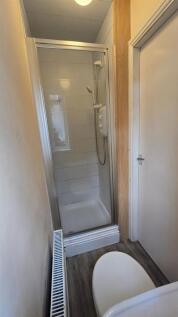 Compact and functional bathroom featuring a mod...
