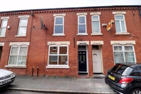 Front view of a traditional terraced brick hous...