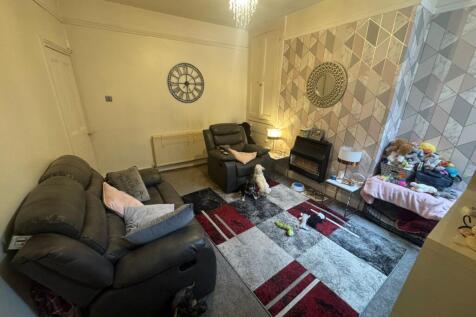Cozy living room featuring comfortable sofas an...