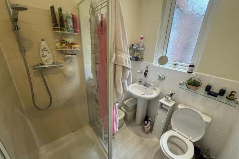 Bright and well-maintained bathroom featuring a...