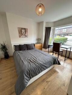 Bright and inviting double bedroom featuring a ...