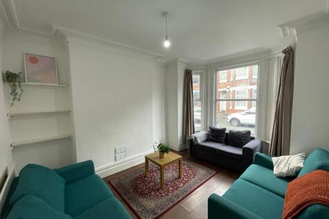 Bright and welcoming living room featuring a la...