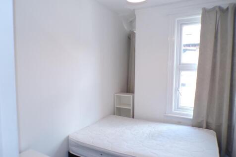 This inviting double bedroom features a bright ...