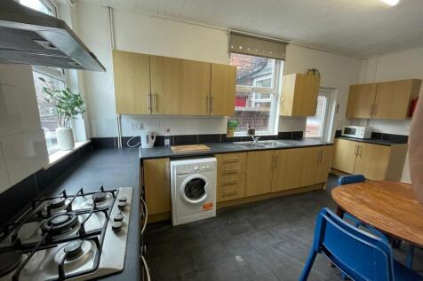 Bright and functional kitchen with ample natura...