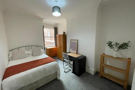 Bright and inviting master bedroom featuring a ...