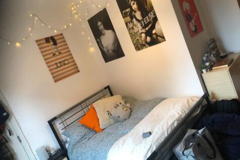 A cozy double bedroom featuring stylish decor w...