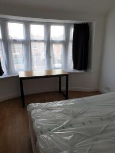Bright and inviting double bedroom featuring la...