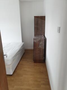 Discover a cozy double bedroom featuring a comf...